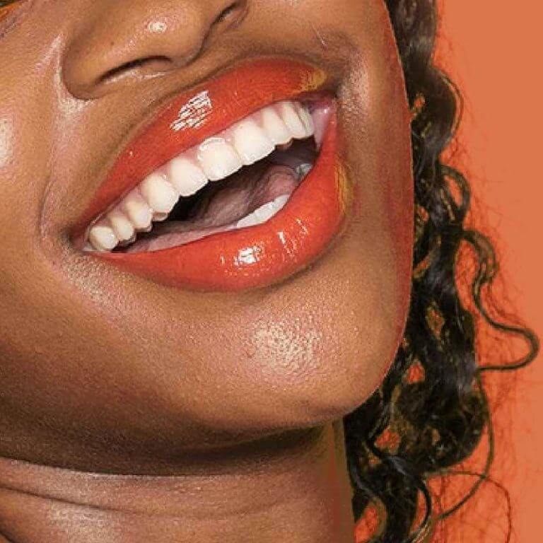 an image of a girl smiling bright white smile good dental hygiene