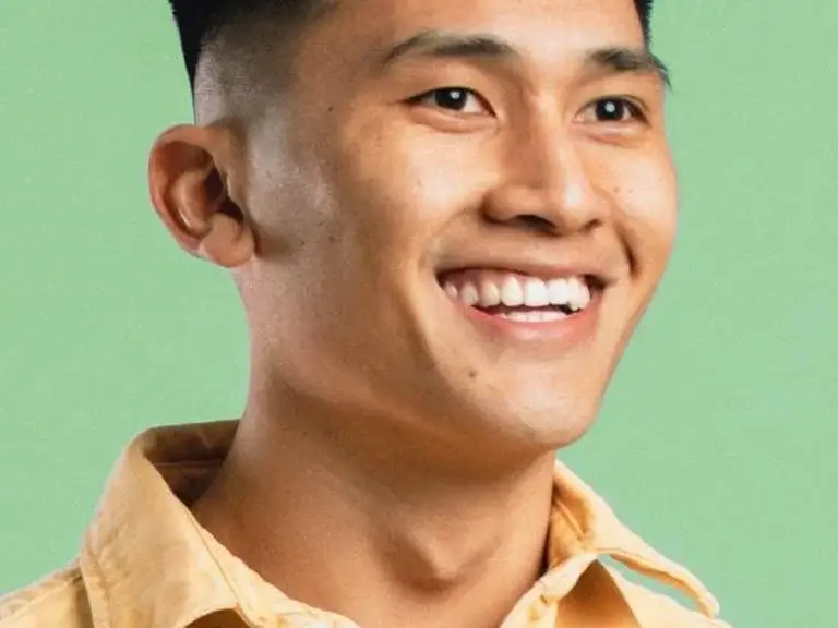 an image of a man smiling happy with his air polish treatment