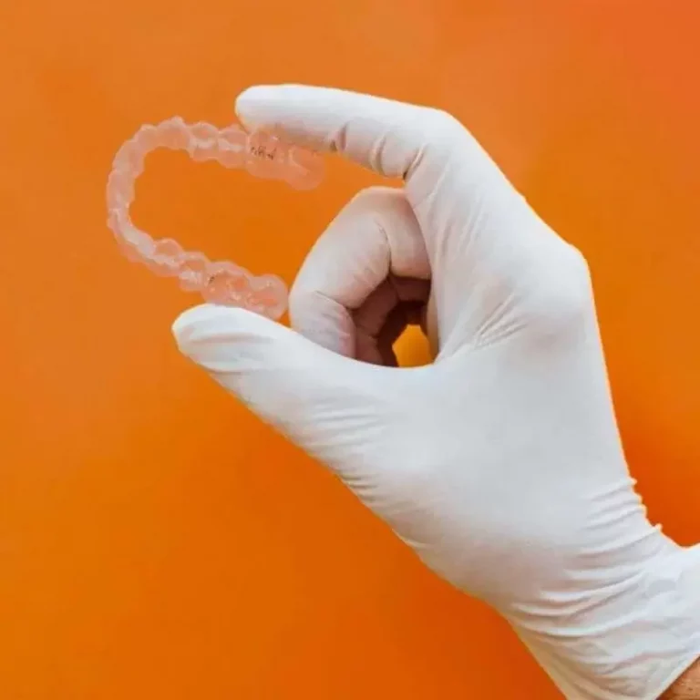 an image of a liverpool based orthodontist holding an invisalign