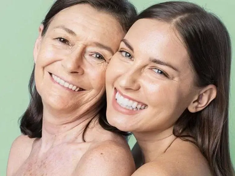 an image of two women after their gum contouring treatment